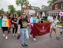 The Faculty of Education Banner Marching down the street at Pride Parade